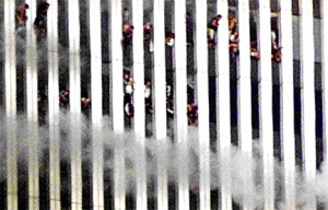 Colour photograph showing people trapped at the top of one of the WTC Towers. This Tower collapsed soon afterwards.