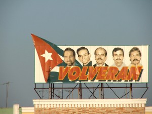 Colour photograph showing a Miami Five Freedom Campaign Hoarding on the top of a building in Cienfuegos, Cuba. Photograph by CJ Walsh. 2007-04-14. Click to enlarge.
