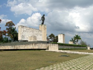 Colour photograph showing the memorial in Plaza de la Revolución, Santa Clara, Cuba ... built to commemorate the 30th anniversary of the Battle for Santa Clara. Unveiled on 28 December 1988, it was designed by the Architect Jorge Cao Campos and the Sculptor José Delarra. The memorial complex also comprises the mausoleum of Che Guevara and a museum. Photograph by CJ Walsh. 2007-04-14. Click to enlarge.