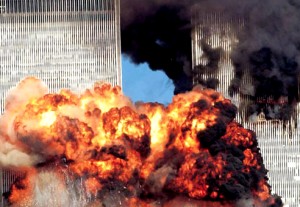 Colour photograph showing the two World Trade Center Towers immediately after the impact of the second plane. At a fundamental level, this was a 'real' extreme fire event ... which was extensively investigated by the U.S. National Institute of Standards & Technology (NIST) ... and resulted in the important 2005 & 2008 NIST WTC Recommendations. Click to enlarge.